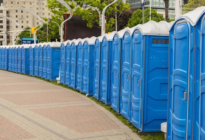 a row of portable restrooms at a fairground, offering visitors a clean and hassle-free experience in Elgin